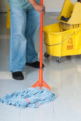 Global Cleaning USA janitor in Darien, IL mopping floor.